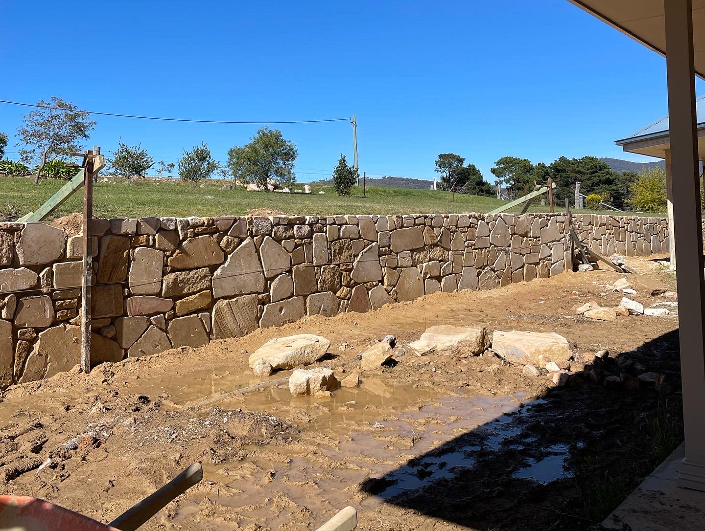Long natural stone retaining wall